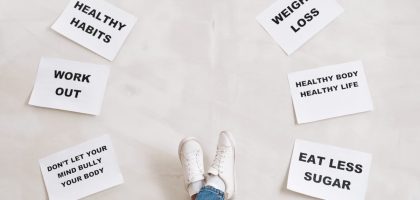 Inspirational health and fitness messages with shoe-clad feet, promoting healthy habits and wellbeing.